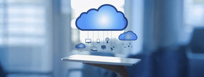 Cloud over desk with a bunch of devices hanging from it