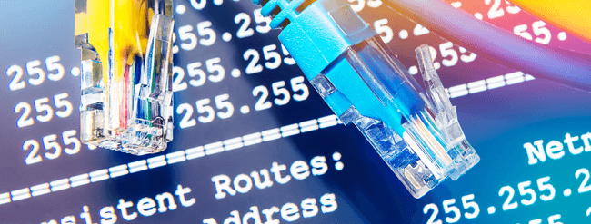 Network cables over screen showing IP addresses.