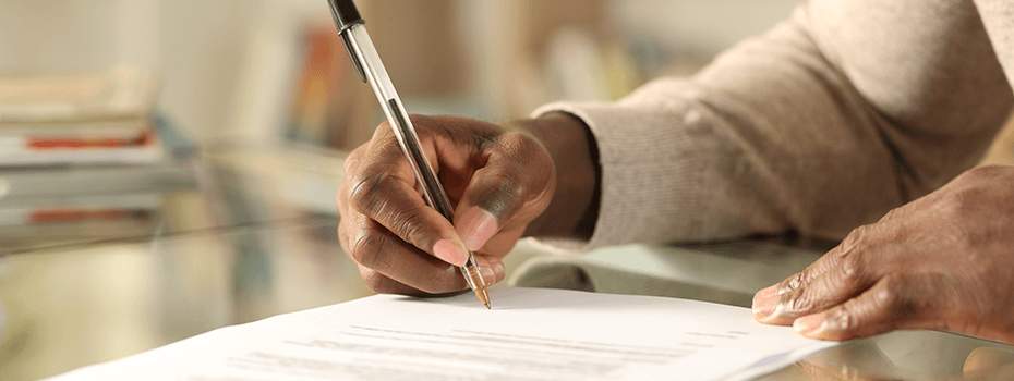 A man signing a document