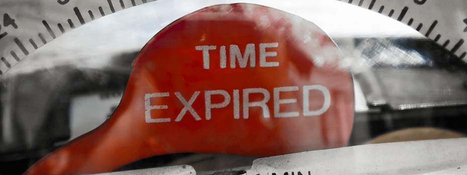 Closeup of time expired flag on parking meter